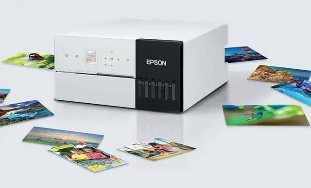 Epson SureLab SL-D500 compact photo printer with printed photos